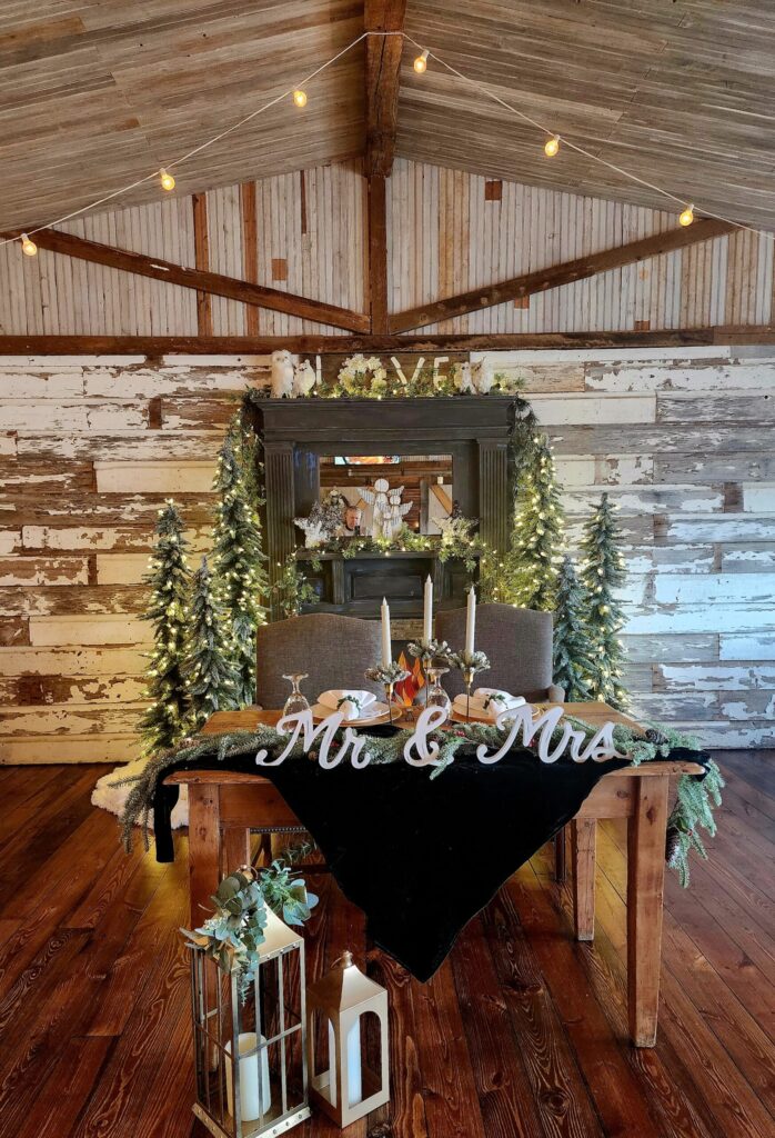 winter wedding couple table at The Barn at Blueberry Hill wedding venue with lodging located in Elkin, NC near Winston-Salem and Charlotte