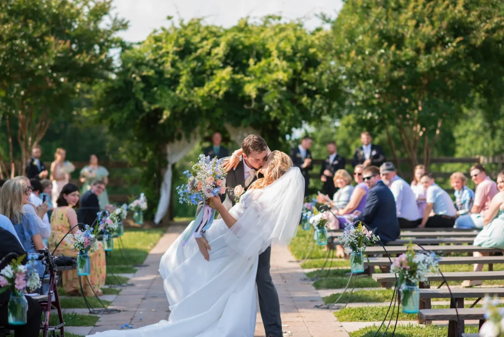 Dip during couple exit The Barn at Blueberry Hill locally owned wedding venue with bartender, DJ and lodging in Elkin NC located near Winston-Salem and Charlotte
