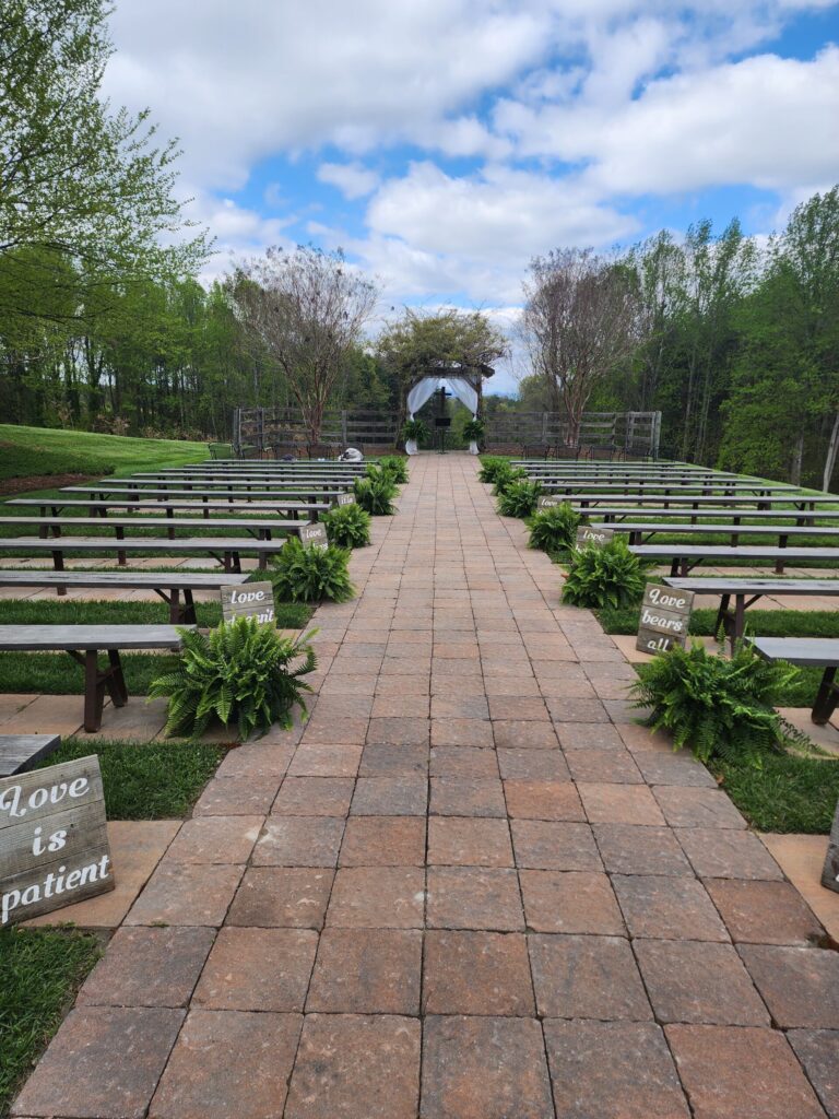 spring wedding with ferns at locally owned wedding venue The Barn at Blueberry Hill in Elkin NC located near Winston-Salem and Charlotte