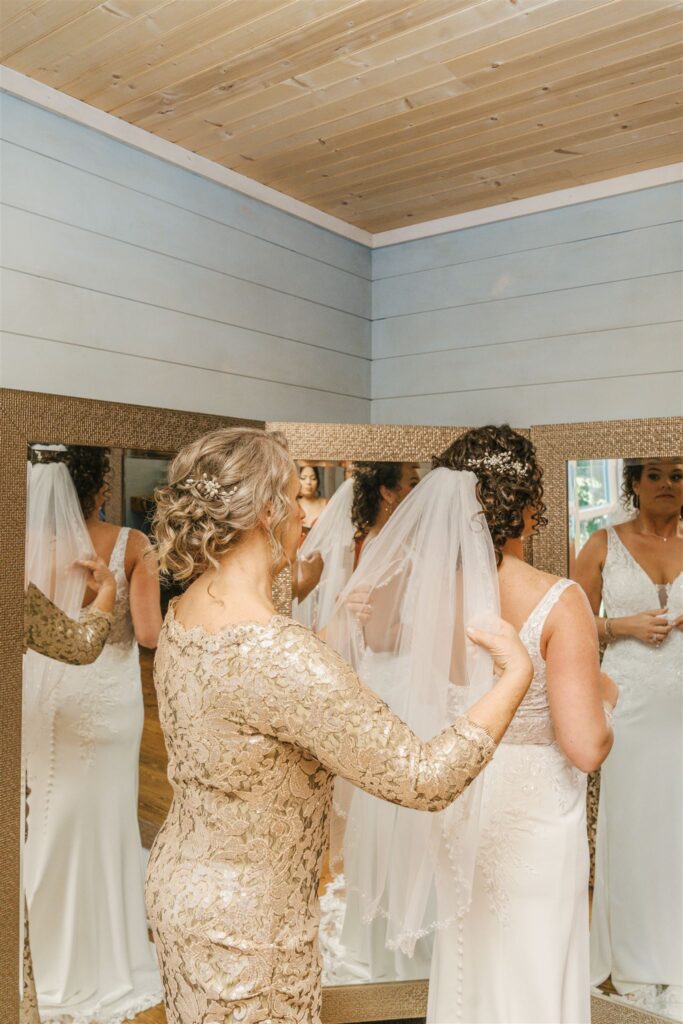 Mother sharing a special moment with bride at The Barn at Blueberry Hill a locally owned wedding venue with lodging, bartender and DJ in Elkin NC located near Winston-Salem and Charlotte
