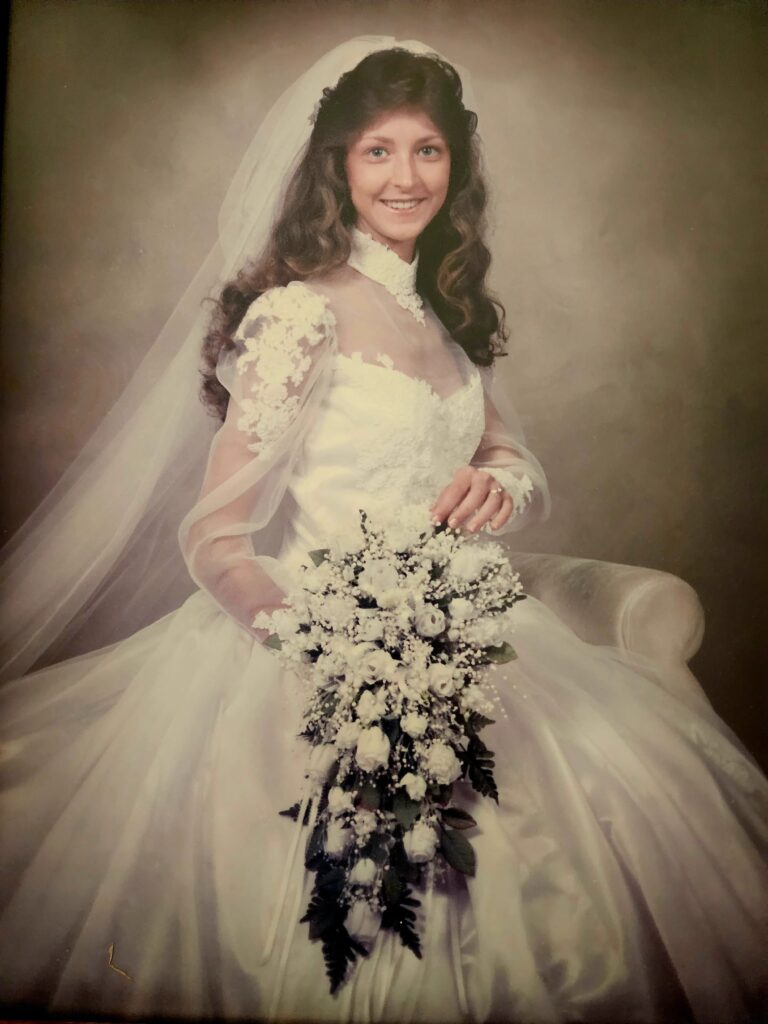 sister in law of owner as shown in wedding gown at the Barn at Blueberry Hill a locally owned wedding venue in Elkin NC with lodging, DJ and bartender included near Winston-Salem and Charlotte