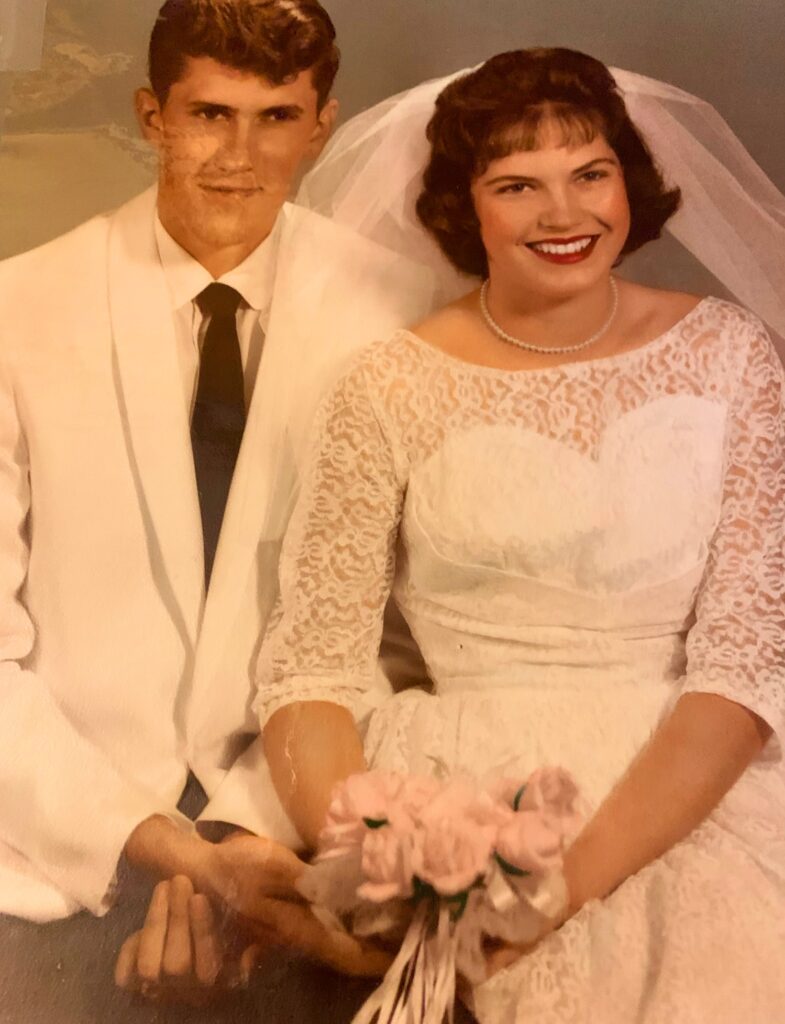 Aunt in wedding gown and uncle of owners of the Barn at Blueberry Hill a locally owned wedding venue in Elkin NC with lodging, DJ and bartender included near Winston-Salem and Charlotte
